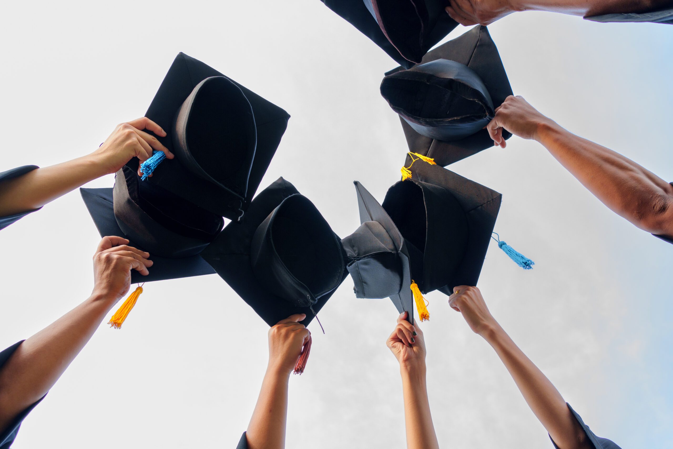 Graduation Caps Thrown in the Air success graduates of the university,Concept education congratulation graduates in University.